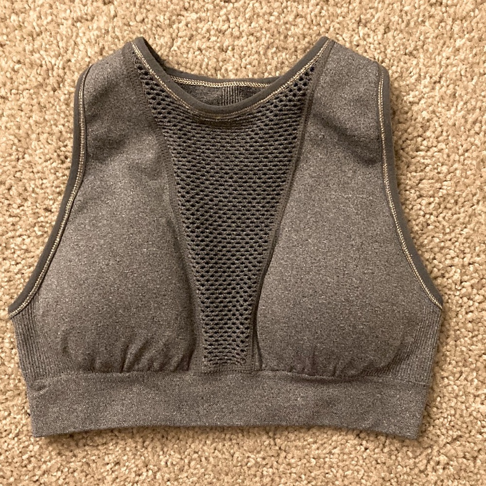 XS Gray padded sports bra with mesh detailing and golden seams; removable pads